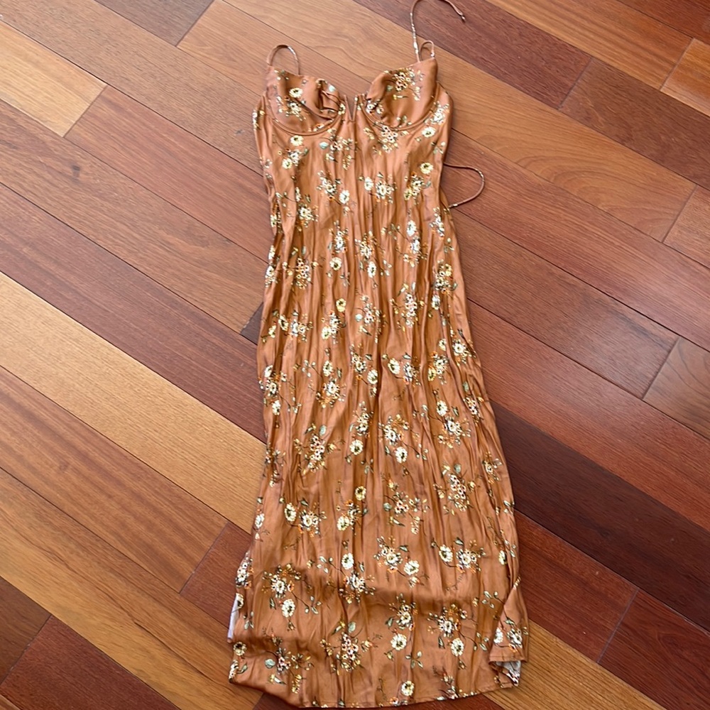 Sun becomes her dress never worn